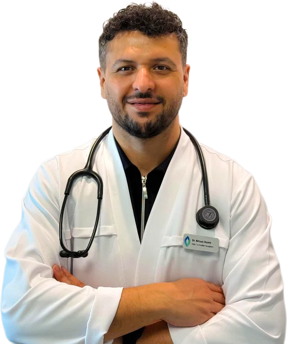 Dr. Mesut Demir, hair transplant surgeon, in a white coat with a stethoscope